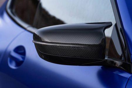 Carbon fiber side mirror cover for BMW models with RikeShield Films.