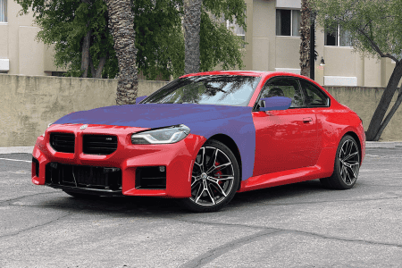 Custom BMW M2 with full hood, fender, and mirror film wrap in red and blue.