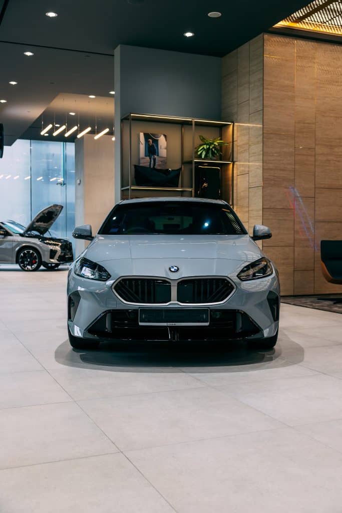 BMW car with protective film in showroom.